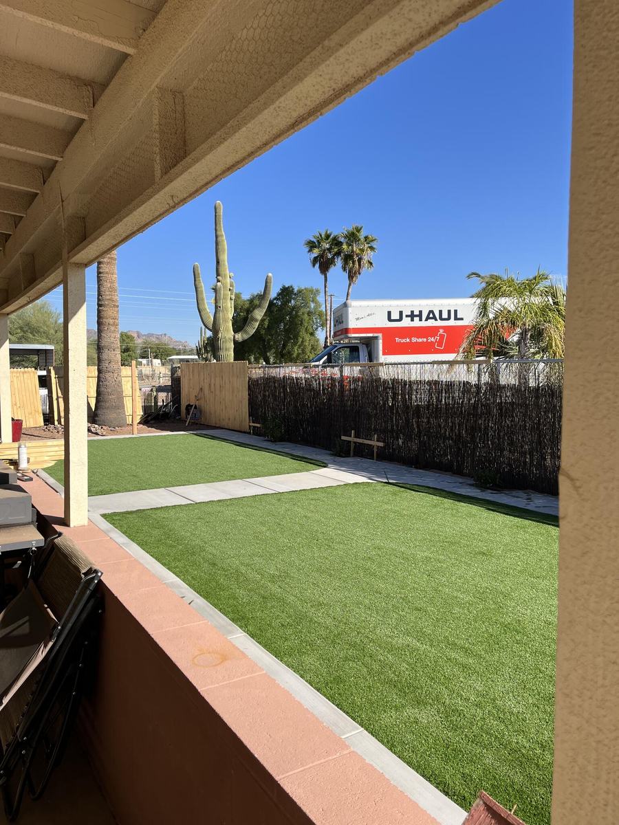 Backyard artificial grass installed by Family Tree Trimming